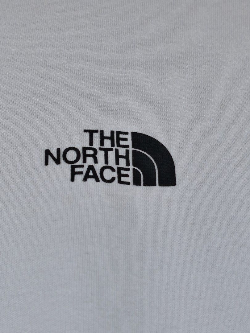The North Face Never Stop Exploring White T-Shirt (Category: Tshirts & Polo Shirts ) located in Manila. Submitted by ajsellingthrift (Listing ID 1468673323, Image 3). Description: - Brand: The North Face - Color: White -Dimes: 21.5 by 25.5 - Size: US Small / Asia Medium - Material: 100% Cotton (soft and breathable) - Design: Small chest logo with large circular 'Never Stop Exploring' back graphic - Care: Machine washable - Condition: Brand new / 