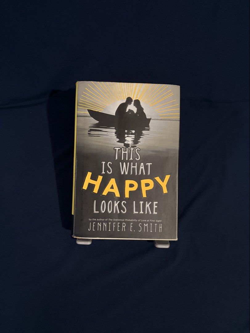 This Is What Happy Looks Like by Jennifer E. Smith (Category: Storybooks) located in Manila. Submitted by cakeseuper (Listing ID 1468657144, Image 1). Description: Title: This Is What Happy Looks Like by Jennifer E. Smith ✅ Hardbound 🏷️ Original Price/ Bought at: ₱700 📦 Condition: the book shows signs of age (brown pages, dusts and faded cover) but it is still intact. 🧾 Payment: Gcash/ Bank Transfer (Payment First) 🛵 Delivery: Metro Manila On