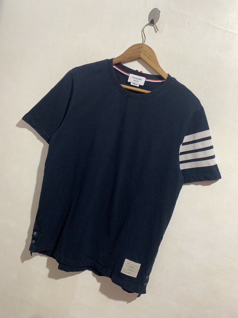 THOM BROWNE 4-BAR TEE (Category: Tshirts & Polo Shirts ) located in Gumaca. Submitted by getscore.ph (Listing ID 1468557068, Image 3). Description: WTS ❗️THOM BROWNE 4-BAR TEE❗️ ✅Size: 4 on tag ✅Dimes: Width 21 Length 29.5 ✅Color Rate: 9.5/10 ✅Condition: Excellent ✅Issue: Mone Color may due to lightning FRESH FROM BALE NEED WASH 🫧💦 Mura lang DM ME TO PURCHASE 📥📥 📍Loc. Gumaca,Quezon 📍Courier: JNT EXPRESS.