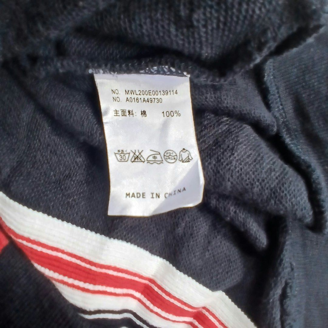 Thom Browne New York Hooded Zip Jacket (Category: Coats, Jackets and Outerwear) located in Montevista. Submitted by rdthriftshub (Listing ID 1468546876, Image 2). Description: - Brand: Thom Browne New York - Style: Full zip hoodie in dark navy - Material: 100% premium cotton - Details: Signature red, white, and blue grosgrain stripe tape on hood and inner collar - Hardware: Gold-tone dual zipper pulls - Features: Button cuffs, side hem vents with