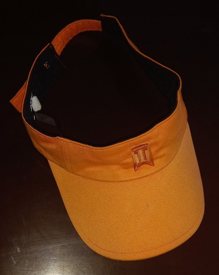 TIGER WOODS Orange Sun Visor with Embroidered Logo (Category: Caps & Hats) located in Cagayan de Oro. Submitted by edwardryan01984 (Listing ID 1468650256, Image 1). Description: - TIGER WOODS Vibrant orange sun visor perfect for golf, outdoor activities, or bright days - Curved brim effectively blocks glare - Stylish embroidered logo patch on the front band - Adjustable back strap for a secure and comfortable fit - Black inner lining helps keep s
