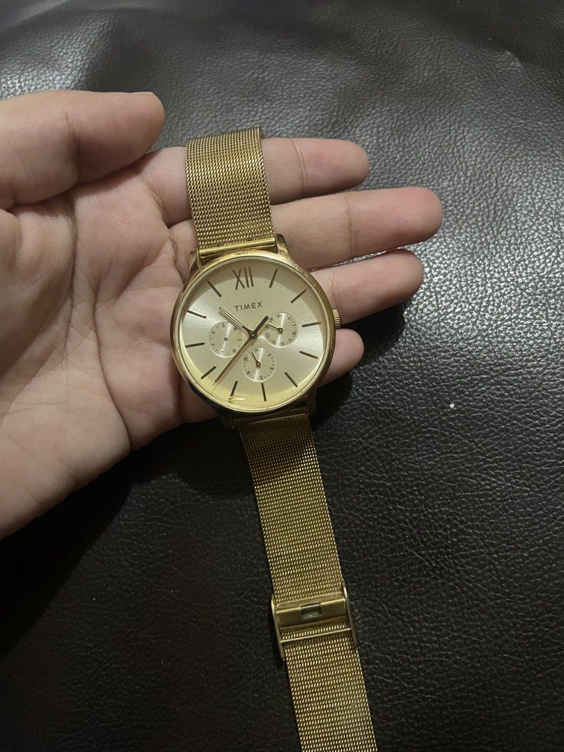 Timex Gold Mesh Chronograph Wristwatch (Category: Women's Watches) located in Mandaluyong City. Submitted by angelxx_ (Listing ID 1468705586, Image 1). Description: - Brand: Timex - Style: Gold-tone wristwatch with a modern mesh strap - Dial: Round featuring sub-dials and Roman numeral marker at 12 o'clock - Closure: Standard clasp - Condition: Minimal wear on casing and strap - Battery: Status unknown Honest Issue: Natanggal ung isang subdial pe