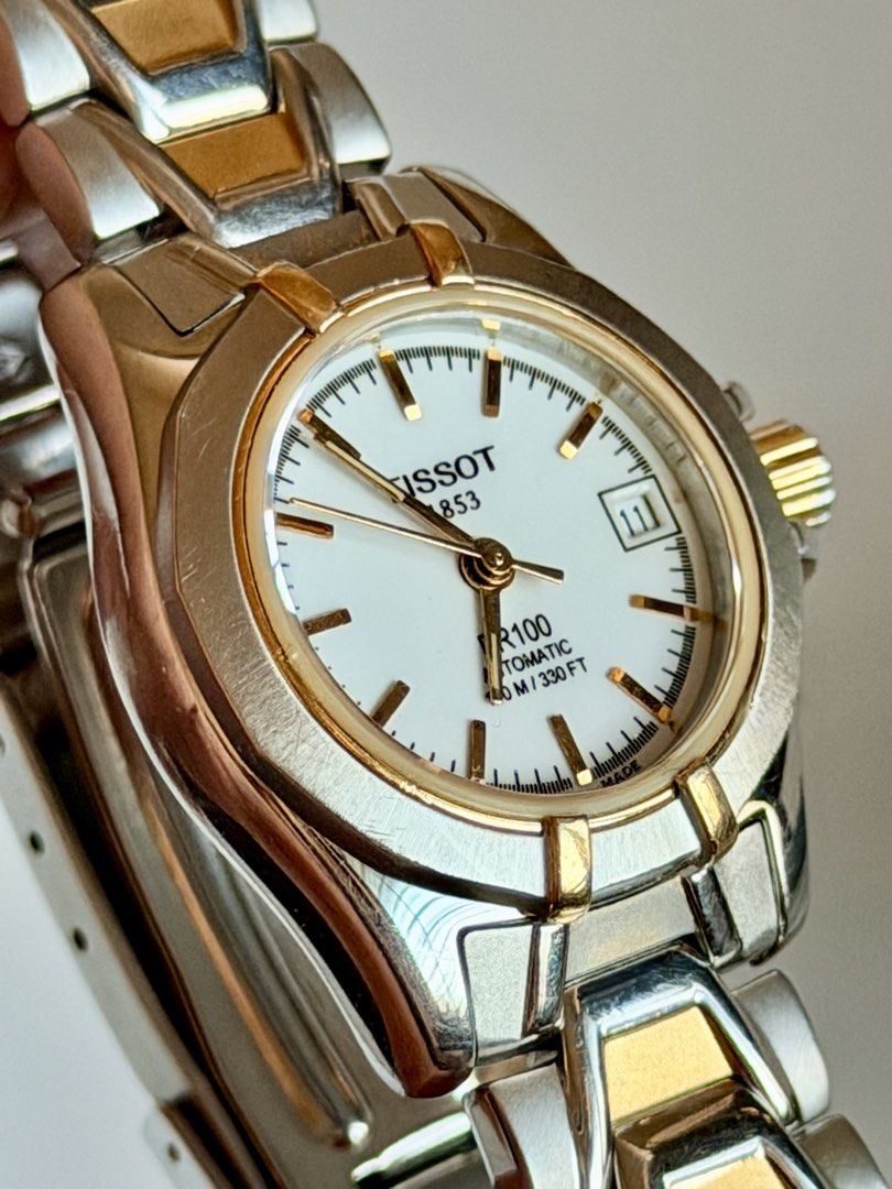 Tissot PR 100 Automatic (Category: Women's Watches) located in Manila. Submitted by vibeandvintage (Listing ID 1468603615, Image 3). Description: ⌚️ Tissot PR 100 Automatic •Ladies •Automatic movement •White dial •Two-tone stainless steel and gold plated accents •24mm case diameter (excluding crown) •Up to 6.8 inches wrist size •Original watch head and bracelet •With signs of usage •Good working condition •Unit only — no papers •Comes with a pres