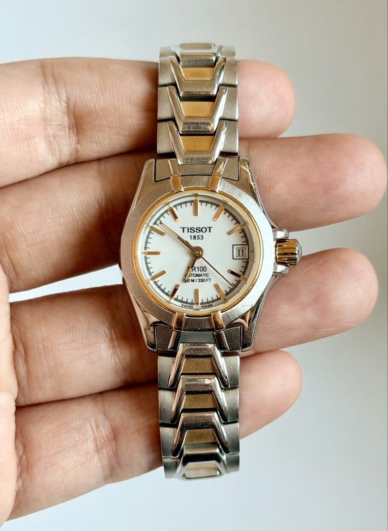 Tissot PR 100 Automatic (Category: Women's Watches) located in Manila. Submitted by vibeandvintage (Listing ID 1468603615, Image 1). Description: ⌚️ Tissot PR 100 Automatic •Ladies •Automatic movement •White dial •Two-tone stainless steel and gold plated accents •24mm case diameter (excluding crown) •Up to 6.8 inches wrist size •Original watch head and bracelet •With signs of usage •Good working condition •Unit only — no papers •Comes with a pres
