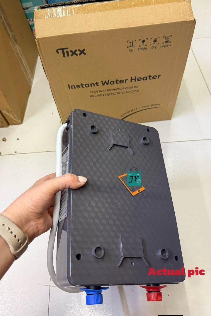 Tixx Basic Model Instant Water Heater Grey (Category: Water Heater & Instant Showers) located in Taguig. Submitted by diannecaya86853 (Listing ID 1468596829, Image 2). Description: Tixx electric water heater 5500w.