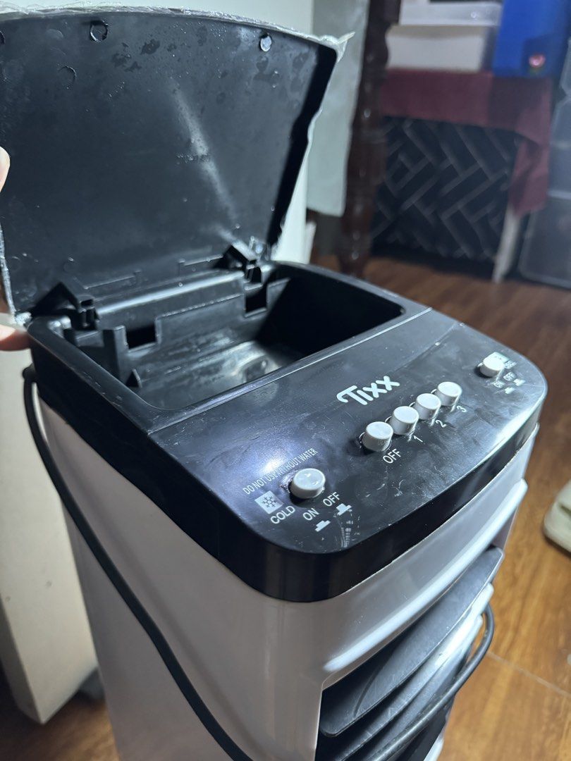 Tixx Portable Air Cooler Fan (Category: Air Conditioning and Heating) located in Santa Rosa. Submitted by d.tfits (Listing ID 1468545650, Image 2). Description: Bought for 1400+ on orange app. Used barely for 2 months. Moved to much smaller space kaya i dont need it na. Loc. Kamuning qc.