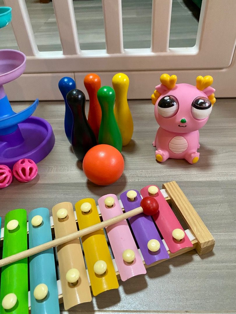 Toddler toy bundle with xylophone, drop tower, bowling (Category: Kids Toys) located in Bauang. Submitted by tinyhandspreloved (Listing ID 1468679078, Image 2). Description: - 4-in-1 toy bundle perfect for toddlers and young kids - Includes a colorful wooden xylophone with its mallet - Multi-level swirl drop tower featuring a cute bear hoop and small balls - Mini bowling set with 6 colorful pins and 1 orange ball - Soft and adorable pink squishy 