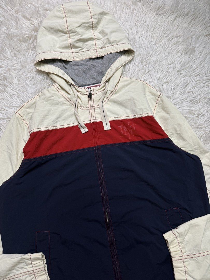 Tommy hilfiger (Category: Coats, Jackets and Outerwear) located in Baguio. Submitted by sellingtonshop (Listing ID 1468524800, Image 2). Description: t14. Tommy Hilfiger tricolor jacket Size: L Dimes: 27*22 Condition: very good Issue: small scratch on left sleeve and dot stains on right shoulder Mine: 780 Steal: 880 Grab: 980.