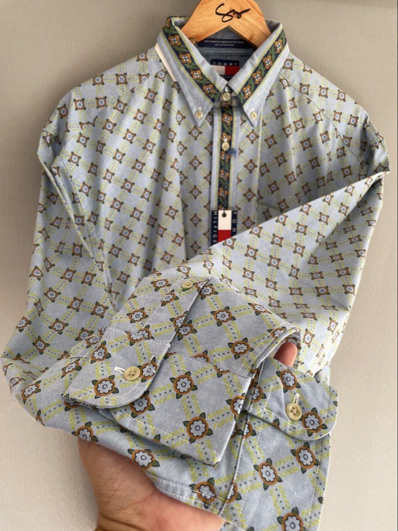 Tommy Hilfiger Button-Up Shirt Floral Pattern (Category: Formal Shirts) located in Mataasnakahoy. Submitted by zero4thrift (Listing ID 1468561810, Image 3). Description: - Brand: Tommy Hilfiger - Condition: Brand new with original tag attached - Size: Medium - Color/Design: Light blue with all-over floral pattern and contrasting green/yellow floral trim on the collar and placket - Material: 100% cotton (Made in Mauritius) - Features: Long sleeves