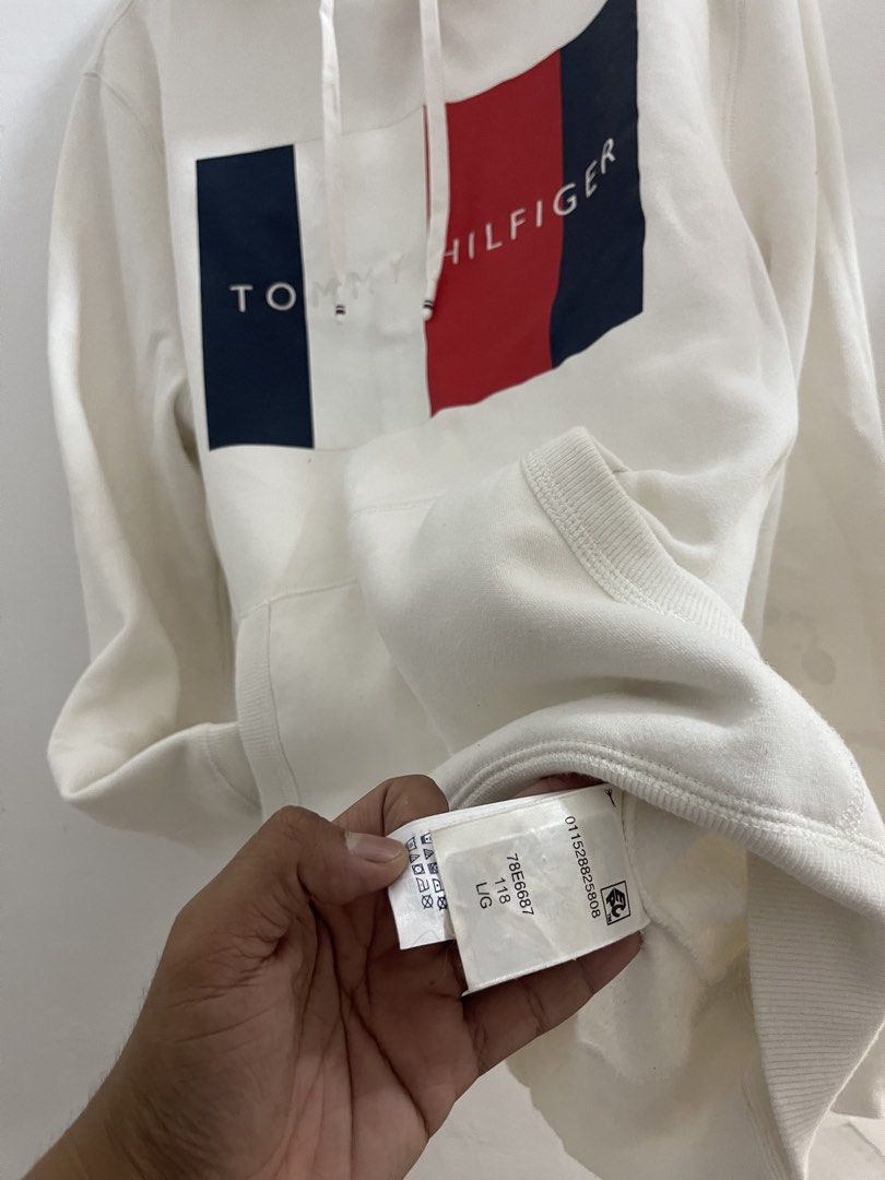Tommy Hilfiger Off-White Hoodie (Category: Coats, Jackets and Outerwear) located in Santa Rosa. Submitted by odepangilinan (Listing ID 1468507901, Image 3). Description: Classic brand logo block print across the chest. Cozy, clean, and ready to wear..