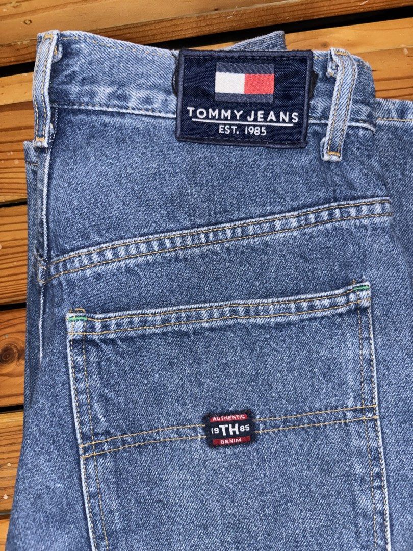 Tommy Jeans Denim Jeans Size 29/32 (Category: Jeans) located in Calamba. Submitted by winter_thrifts (Listing ID 1468610196, Image 2). Description: - Brand: Tommy Jeans - Style: Classic straight leg denim pants with utility loop detail - Color/Wash: Blue wash - Size: 29/32 W x 42 L - Details: Signature branding patches on back pocket and waistband, button closure with zipper fly - Condition: Clean hardware and sturdy stitching throughout, minor d