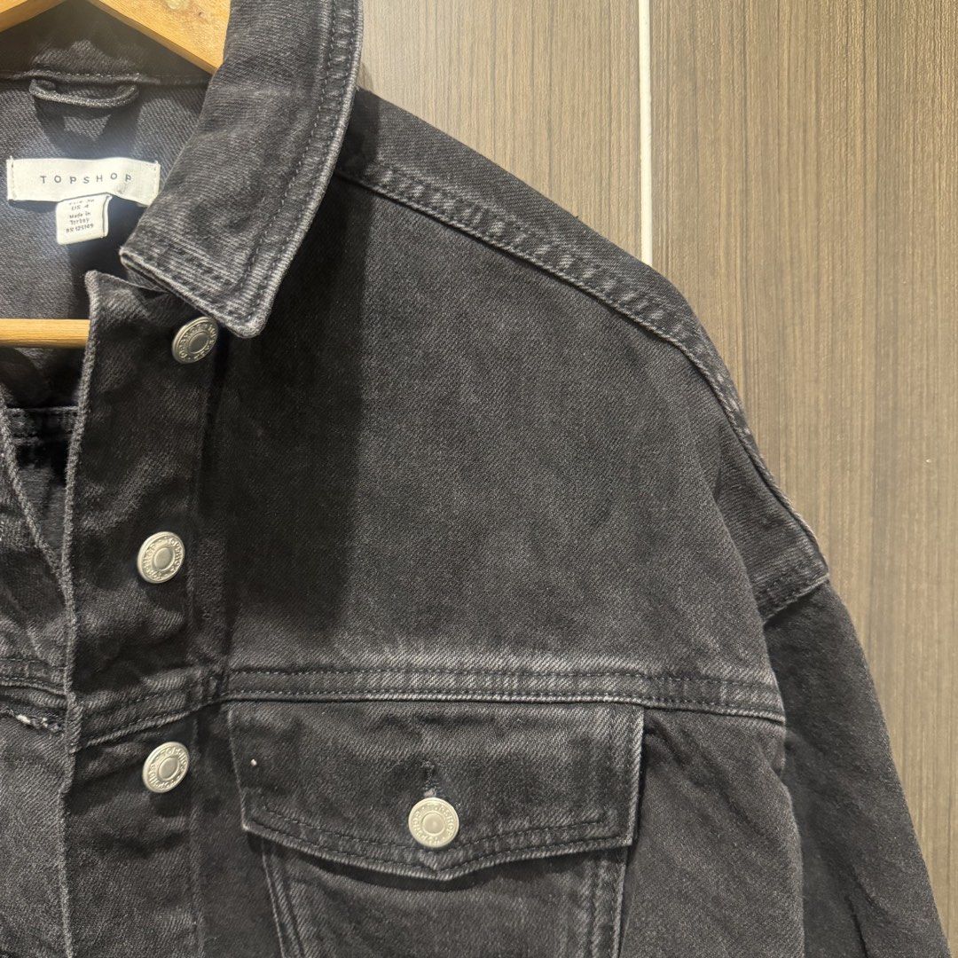 Topshop Black Denim Cropped Jacket (Category: Coats, Jackets and Outerwear) located in Marikina City. Submitted by lou.and.trio (Listing ID 1468570311, Image 3). Description: - Condition: Used once - Style: Black denim cropped jacket with raw frayed hem - Size: UK 8 / EUR 36 / US 4 - Details: Silver metal buttons, classic collar, chest pockets, and button cuffs.