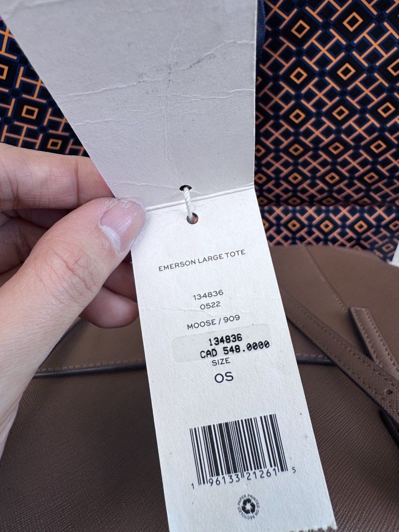 Tory Burch Emerson Large Tote Moose Brown (Category: Tote Bags) located in Quezon City. Submitted by gorjuspots (Listing ID 1468704611, Image 2). Description: - authebtic with original store tags attached (bought from Canada) - Authentic Tory Burch Emerson large tote in a versatile moose brown color - Crafted from durable and clean saffiano leather with elegant gold hardware - Structured design with comfortable top handles - Spacious interior eas