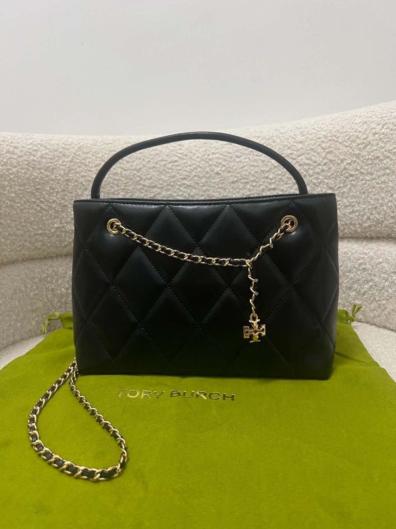 Tory Burch Fleming Carryall Bag (Category: Cross-body Bags) located in Paoay. Submitted by rvf1230 (Listing ID 1468558713, Image 1). Description: - Brand: Tory Burch - Material: Premium black quilted leather - Hardware & Accents: Gold-tone hardware, chain strap woven with leather, matching top handle, and front logo charm - Design: Structured shape with classic diamond quilting - Inclusion: Comes with green Tory Burch dust bag - Condition: Excell