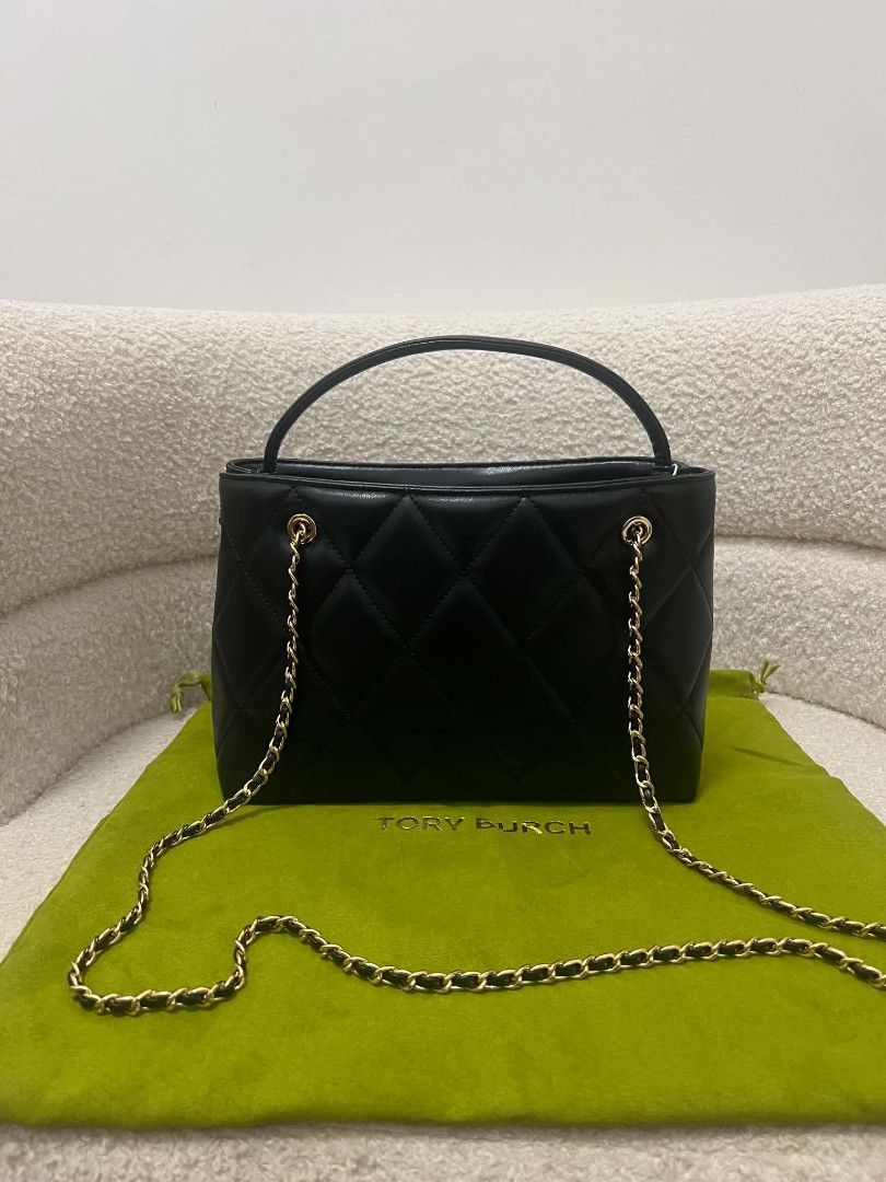 Tory Burch Fleming Carryall Bag (Category: Cross-body Bags) located in Paoay. Submitted by rvf1230 (Listing ID 1468558713, Image 3). Description: - Brand: Tory Burch - Material: Premium black quilted leather - Hardware & Accents: Gold-tone hardware, chain strap woven with leather, matching top handle, and front logo charm - Design: Structured shape with classic diamond quilting - Inclusion: Comes with green Tory Burch dust bag - Condition: Excell