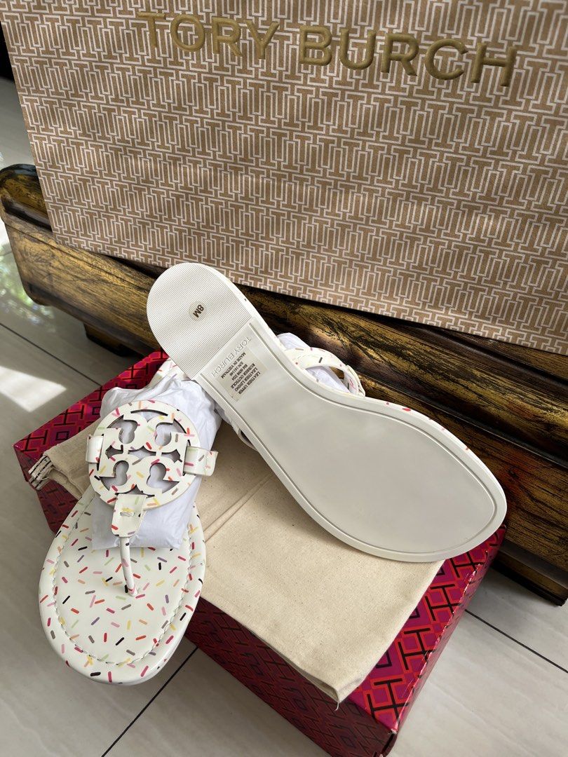 Tory Burch Miller Jelly Thong Sandals (Category: Flats & Sandals) located in Muntinlupa City. Submitted by jane226ph (Listing ID 1468608676, Image 2). Description: Original Brand new, never worn Purchased directly from the boutique. Color White with colorful sprinkles all over Size: US8 Complete with box, dust bag and packaging, sold as originally purchased. Privately owned, and offered at a price well below its original retail value. We have thi