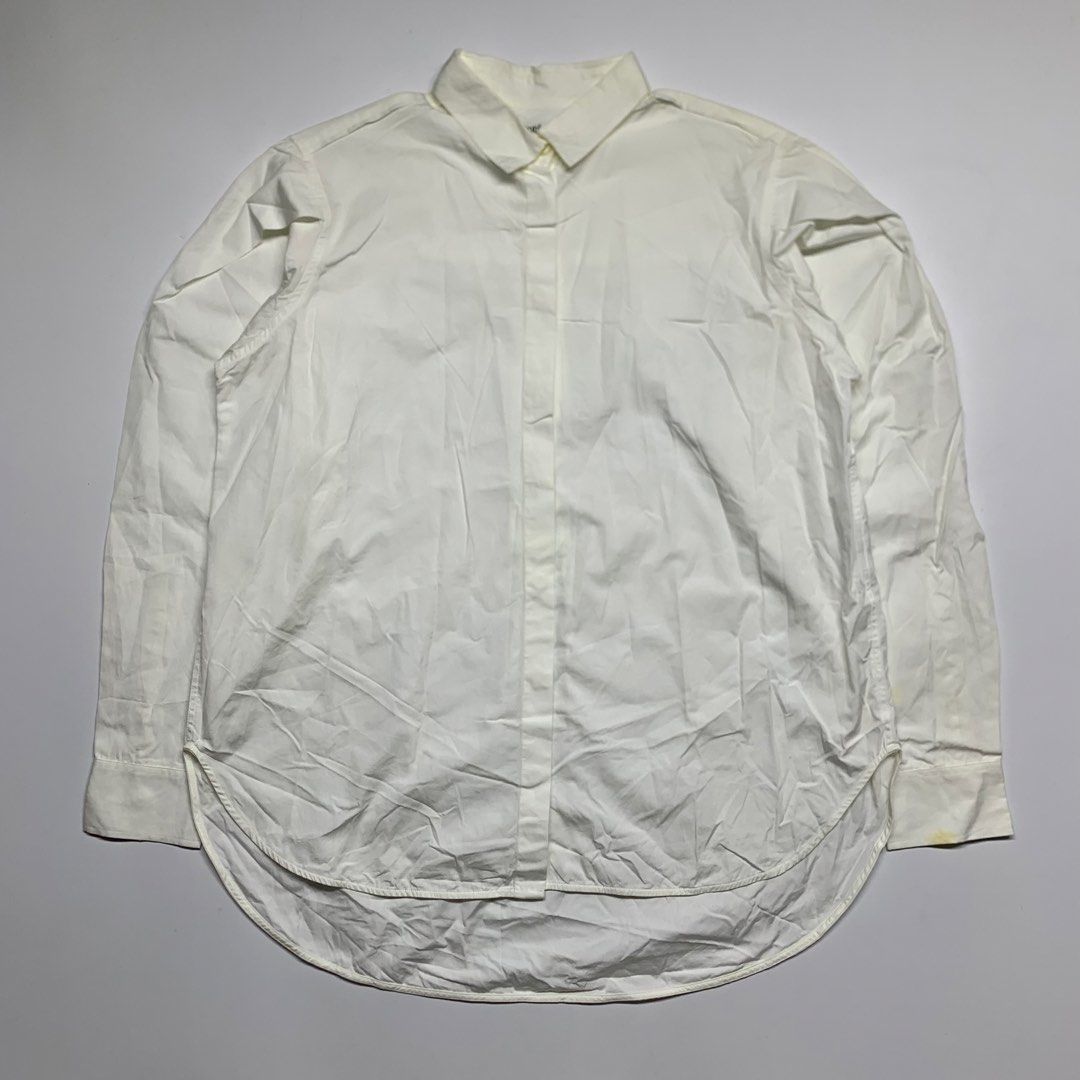 TOTEME - long-sleeve button-up (Category: Longsleeves) located in Manila. Submitted by shottas_21 (Listing ID 1468519726, Image 1). Description: TOTEME - long-sleeve button-up SIZE - Xsmall CONDITION - 9/10 FLAW - washable stain Made in Portugal 100% Cotton CHEST - 21” LENGTH - 28.5” SHOULDERS - 17” SLEEVE - 23.5” HEM - 21”.