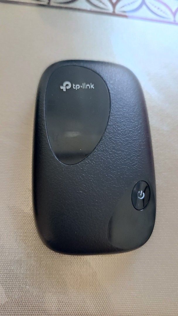TP-Link 4G LTE Mobile Wi-Fi Routers (Category: Networking) located in Manila. Submitted by ryry0108 (Listing ID 1468546680, Image 3). Description: Two TP-Link mobile routers included, plus battery and charging dock. Black finish on both units. Handy power button on the front. Good way to get internet on the go using a SIM card. Tested and working fine. .