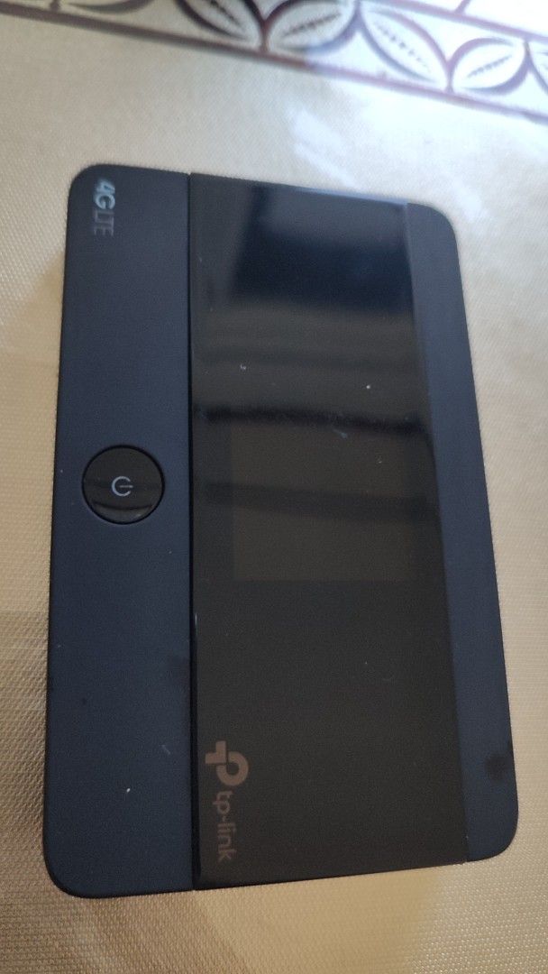 TP-Link 4G LTE Mobile Wi-Fi Routers (Category: Networking) located in Manila. Submitted by ryry0108 (Listing ID 1468546680, Image 2). Description: Two TP-Link mobile routers included, plus battery and charging dock. Black finish on both units. Handy power button on the front. Good way to get internet on the go using a SIM card. Tested and working fine. .