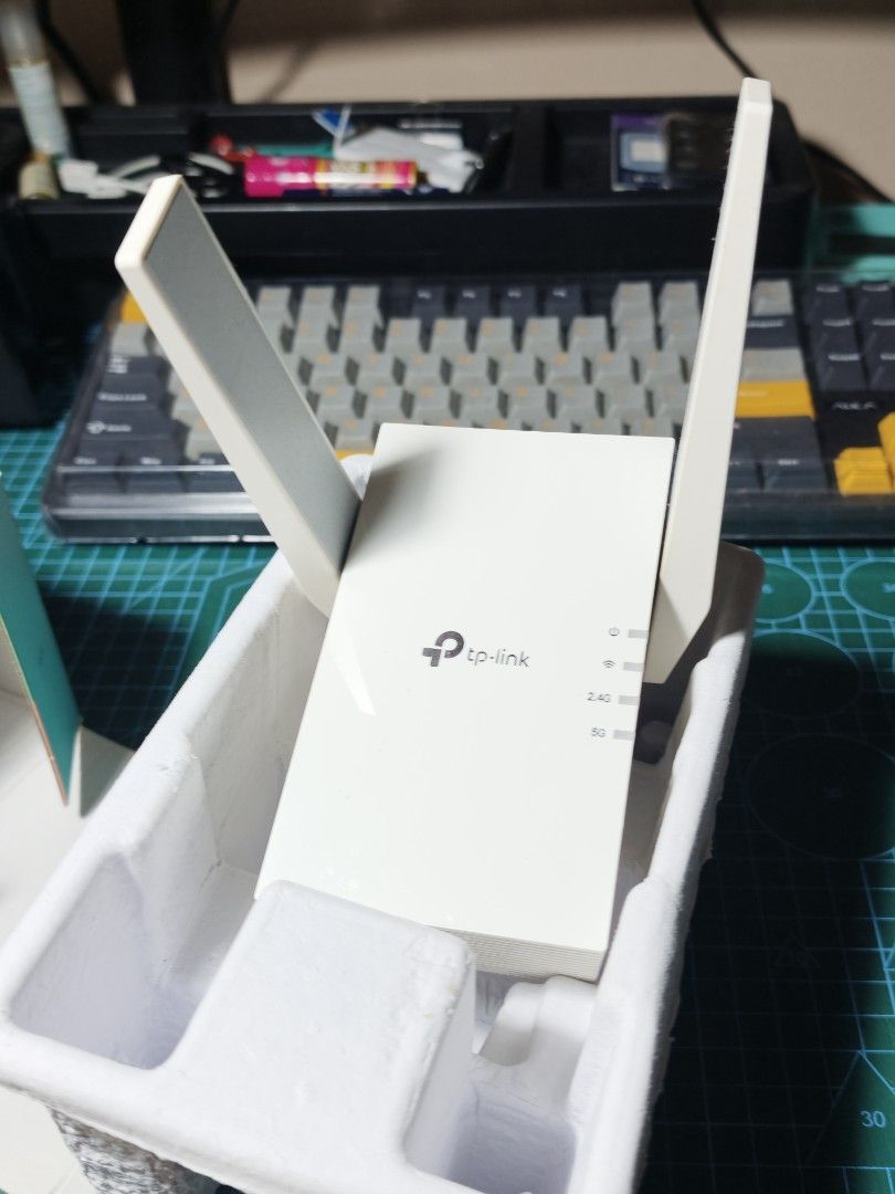 TP-Link AX3000 Wi-Fi 6 Range Extender RE705X (Category: Networking) located in Quezon City. Submitted by christophercsilva (Listing ID 1468500446, Image 3). Description: - Model: TP-Link RE705X AX3000 Dual-Band Wireless Range Extender - Tech: Powered by Wi-Fi 6 to eliminate dead zones and boost coverage - Setup: EasyMesh compatible for seamless whole-home mesh network - Design: Dual external adjustable antennas with direct wall-plug design - Cond