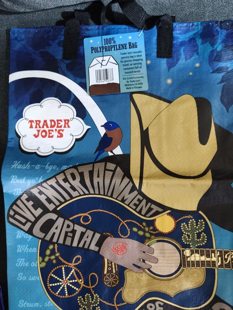 Trader Joe's grocery bag (Category: Tote Bags) located in Pasay City. Submitted by biancabee25 (Listing ID 1468558815, Image 2). Description: brand new with paper tag bought from US back to back design.