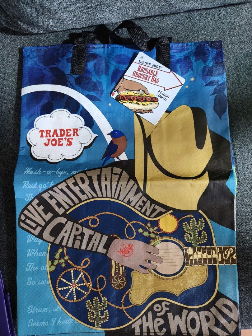 Trader Joe's grocery bag (Category: Tote Bags) located in Pasay City. Submitted by biancabee25 (Listing ID 1468558815, Image 1). Description: brand new with paper tag bought from US back to back design.