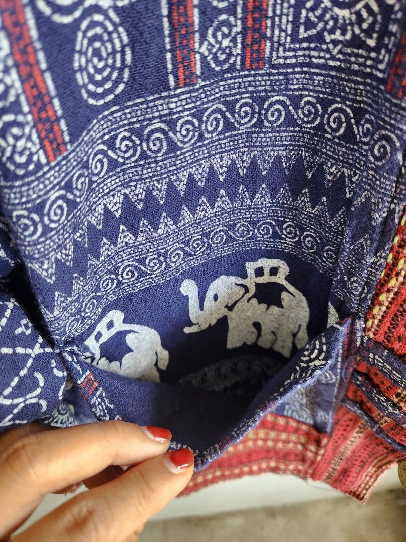 Traditional Thai Elephant Print Cotton Jacket (Category: Coats, Jackets and Outerwear) located in Aurora. Submitted by mothere (Listing ID 1468548755, Image 3). Description: - Material: Comfortable traditional cotton - Design: Blue and white with red woven borders, tribal patterns, and elephant motifs - Details: Long sleeves with patterned cuffs, inside pockets, and coin button loop closure 👌🏽 what you see in the photos is what you will get 🌸 