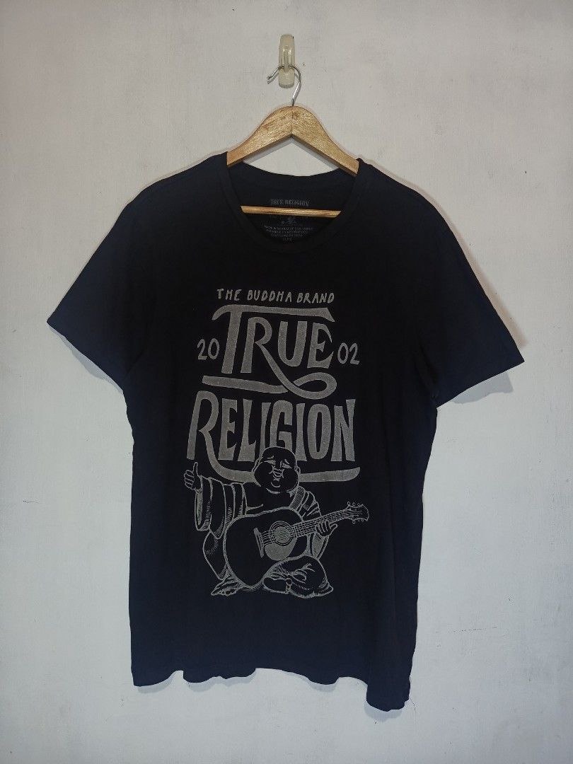 TRUE RELIGION SHIRT (Category: Tshirts & Polo Shirts ) located in Baguio. Submitted by 074thriftmania (Listing ID 1468602569, Image 1). Description: - Brand: True Religion - Style: Upfront Buddha crew neck tee - Color: Black - Size: Extra Large (XL) - Design: Silver print front graphic featuring Buddha, guitar artwork, and '20/'02 lettering - Authenticity: Printed neck label and interior wash tag intact - Origin: Made in Mexico of USA fabric leng