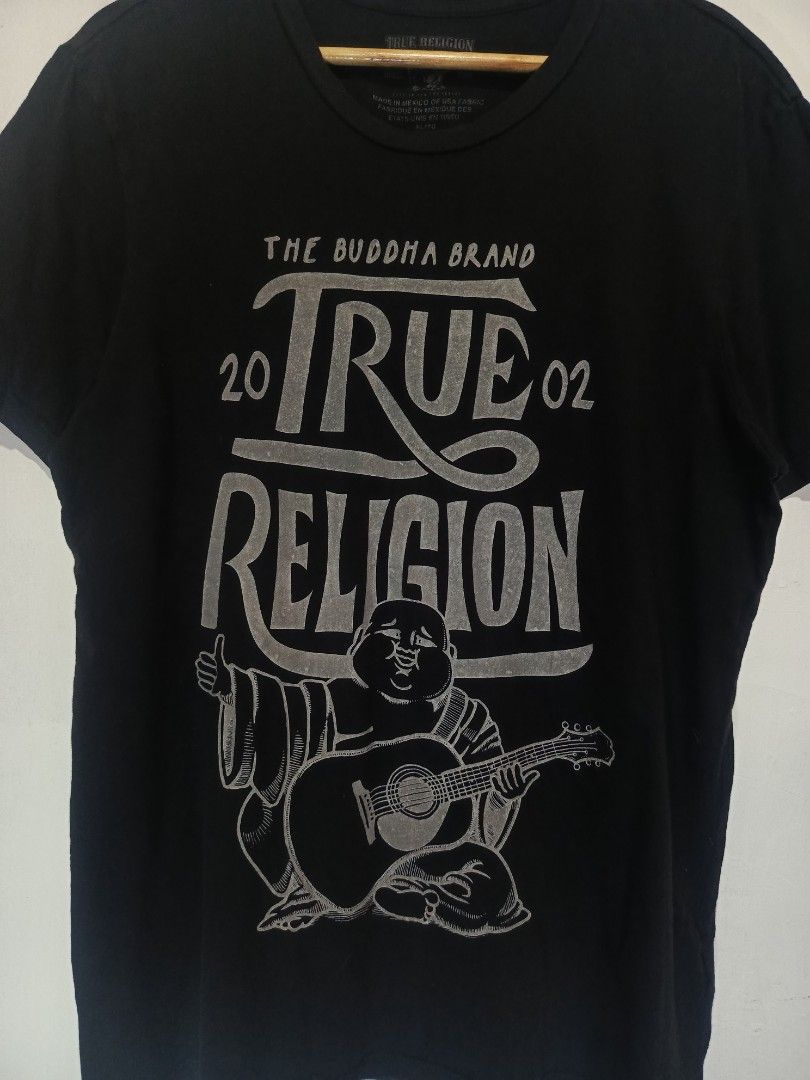 TRUE RELIGION SHIRT (Category: Tshirts & Polo Shirts ) located in Baguio. Submitted by 074thriftmania (Listing ID 1468602569, Image 2). Description: - Brand: True Religion - Style: Upfront Buddha crew neck tee - Color: Black - Size: Extra Large (XL) - Design: Silver print front graphic featuring Buddha, guitar artwork, and '20/'02 lettering - Authenticity: Printed neck label and interior wash tag intact - Origin: Made in Mexico of USA fabric leng