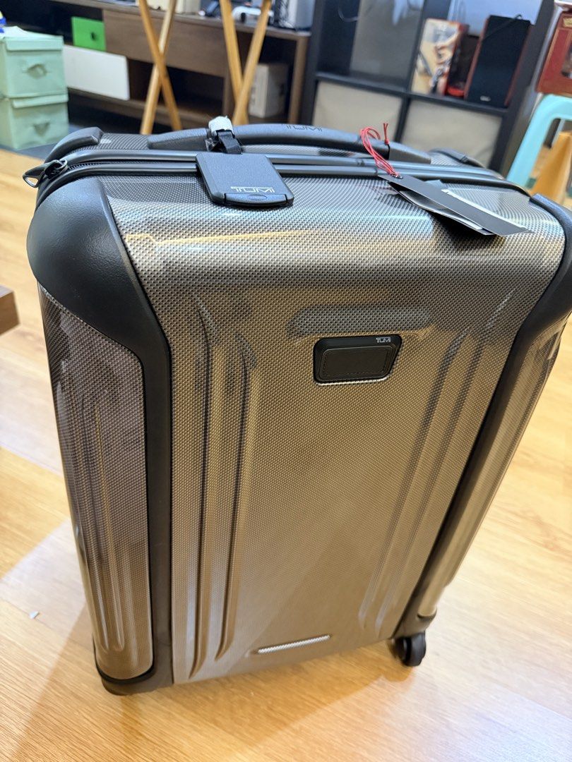 TUMI Luggage Suitcase (Category: Luggage) located in Manila. Submitted by jylesang (Listing ID 1468503300, Image 1). Description: - Brand new with tags attached - Premium TUMI hardside suitcase in a sleek textured grey finish with dark trim - Smooth spinner wheels for effortless mobility - Sturdy telescoping handle and convenient retractable top handle - Large vertical debossed TUMI logo on the rear shell.
