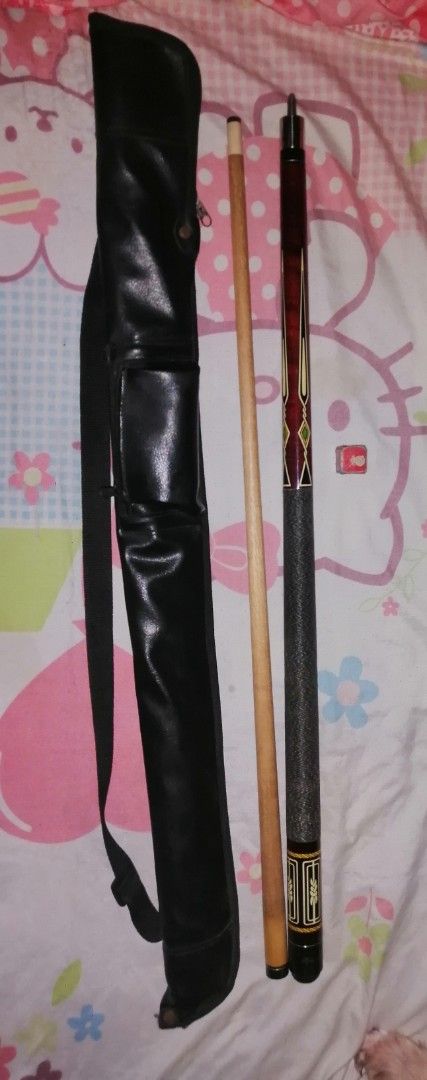 Two-Piece Billiards Cue Stick with Carrying Case (Category: Billiards and Bowling) located in Quezon City. Submitted by rolenalma (Listing ID 1468551102, Image 1). Description: - Two-piece wooden cue stick with a secure center pin joint - Features a stylish textured grip area and classic decorative points - Includes a durable black faux-leather carrying case with a convenient shoulder strap and zipped pocket - Comes with a bonus small piece of re