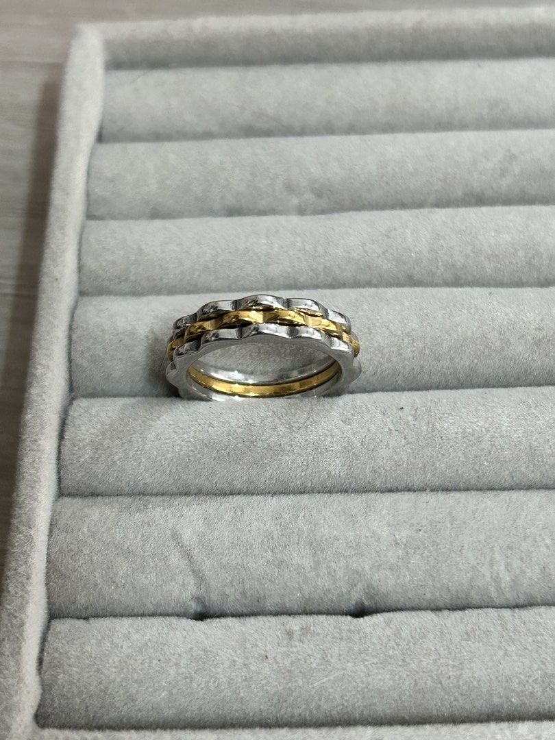 Two-tone wavy stackable ring silver and gold band (Category: Rings) located in Manila. Submitted by elonlineshop (Listing ID 1468500390, Image 3). Description: - Two-tone ring - Wavy silver outer band with a smooth gold inner band - Mixed metal design matches both silver and gold jewelry - Standard band thickness for comfortable daily wear - Clean and excellent overall condition -Stainless Steel.