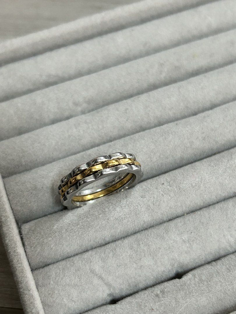 Two-tone wavy stackable ring silver and gold band (Category: Rings) located in Manila. Submitted by elonlineshop (Listing ID 1468500390, Image 2). Description: - Two-tone ring - Wavy silver outer band with a smooth gold inner band - Mixed metal design matches both silver and gold jewelry - Standard band thickness for comfortable daily wear - Clean and excellent overall condition -Stainless Steel.