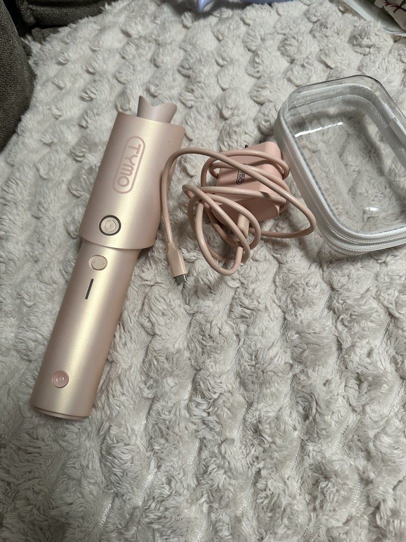 TYMO Curl Go (Category: Hair) located in Taguig. Submitted by kathleen.tan (Listing ID 1468650227, Image 1). Description: Used only for a few times cause I have a lot of hair tools that I prefer more. Bought this cause I thought I can bring it to my Japan trip but bawal pala sa airplane. So most people use this inside car or their offices which is not my lifestyle. Complete set with its charger and box. It used to retail around 5k something .