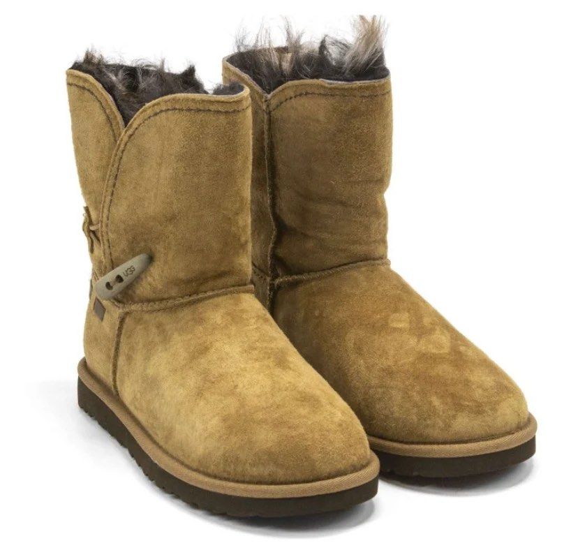 Ugg water resistant 2 way style Meadow Chestnut Boots (Category: Boots) located in Quezon City. Submitted by dropdeadprices (Listing ID 1468595708, Image 1). Description: Ugg Meadow boots in chestnut brown suede. Mid-calf height with a toggle button closure on the side. Fluffy exposed shearling lining inside and around the top collar. Flat rubber soles. Genuine sheepskin material. This stunner can be worn up to show off its distressed wooden togg