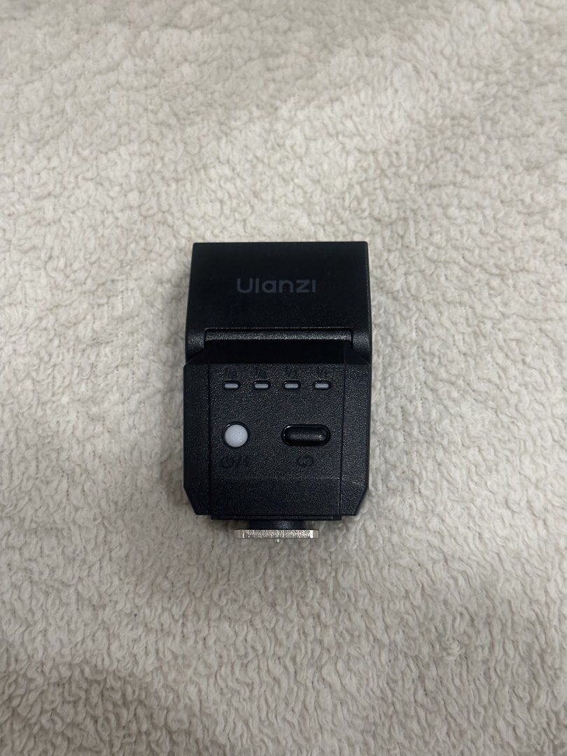 Ulanzi SL03 Mini Camera Flash (Category: Flashes) located in San Juan City. Submitted by decluttrph (Listing ID 1468557863, Image 2). Description: - Brand new Ulanzi SL03 mini camera flash speedlite in sleek black housing - Built-in LED fill light for enhanced illumination and versatile photography setups - Powered by a reliable 3.7V 300mAh rechargeable battery - Clear power output indicator settings on the back panel for easy adjustments - Stand