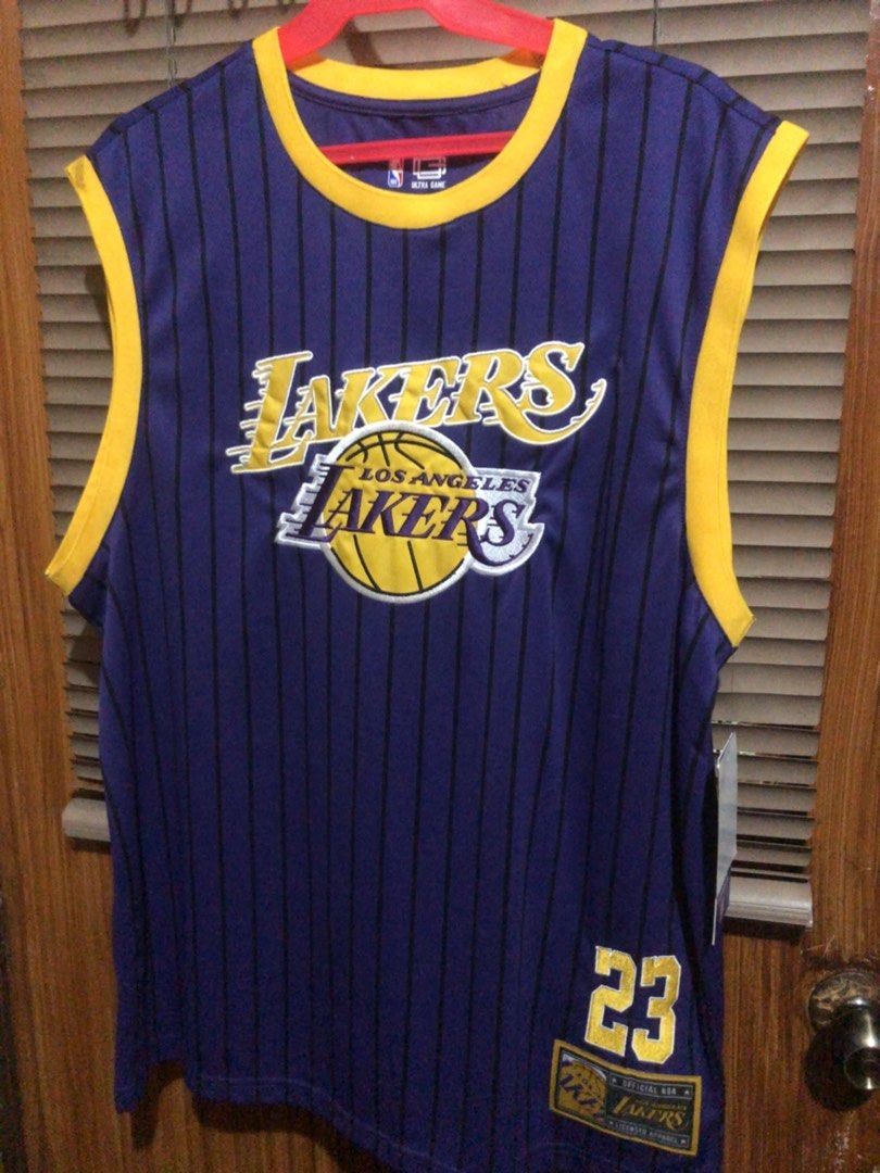 ULTRA GAME NBA OFFICIAL (Category: Activewear) located in Muntinlupa City. Submitted by ybmcloset2230 (Listing ID 1468597070, Image 1). Description: • Brand: Ultra Game • Official NBA Licensed Apparel • Player: LeBron James #23 • Los Angeles Lakers • Details: Gold embroidered number, official Lakers side patch, original tag attached • Condition: Brand new with tags .