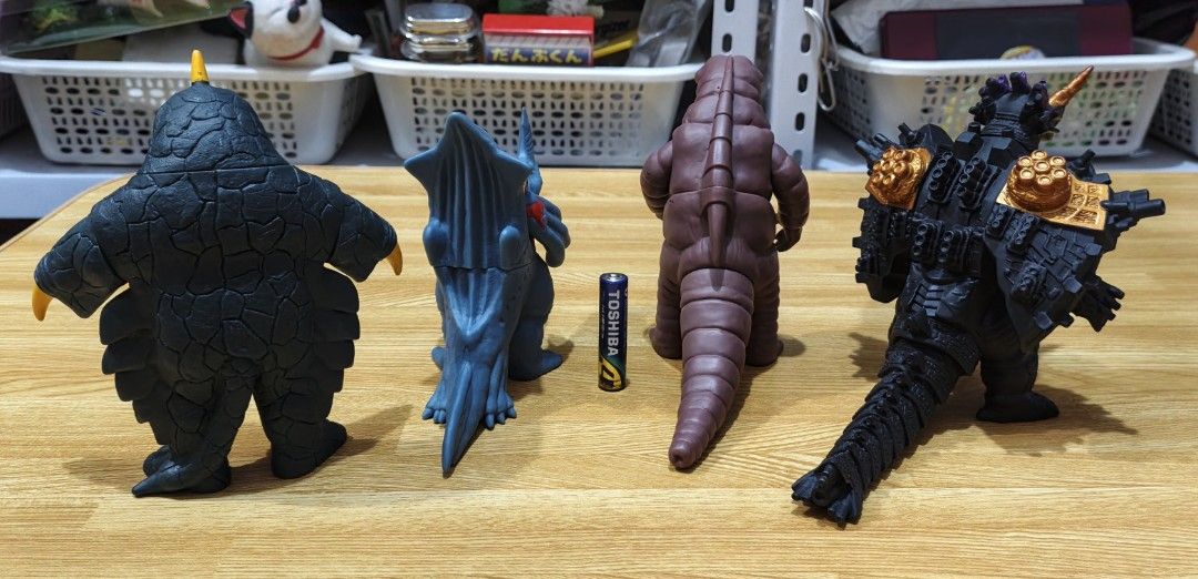 Ultraman Kaiju Sofubi Vinyl Figures Set of 4 (Category: Figurines & Statues) located in San Pedro. Submitted by toydibz (Listing ID 1468534022, Image 2). Description: - Set includes 4 detailed Ultraman monster vinyl figures - Features intricate sculpts and vibrant paint apps - Figures stand securely on their own - Perfect addition to any tokusatsu monster collection - Size reference shown next to a standard AA battery.