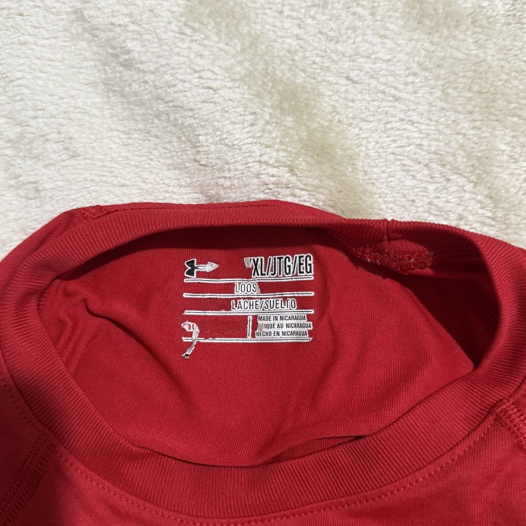Under Armour Red Athletic T-Shirt (Category: Shirts) located in Pasay City. Submitted by bellita_05 (Listing ID 1468554272, Image 3). Description: Authentic-looking Under Armour red sports tee with a classic white logo. Lightweight athletic style, perfect for gym workouts, running, sports, or casual everyday wear. ✨ Colour: Red ✨ Brand: Under Armour ✨ Style: Athletic / Sports T-shirt ✨ Fit: Classic sporty fit ✨ Condition: Pre-loved.