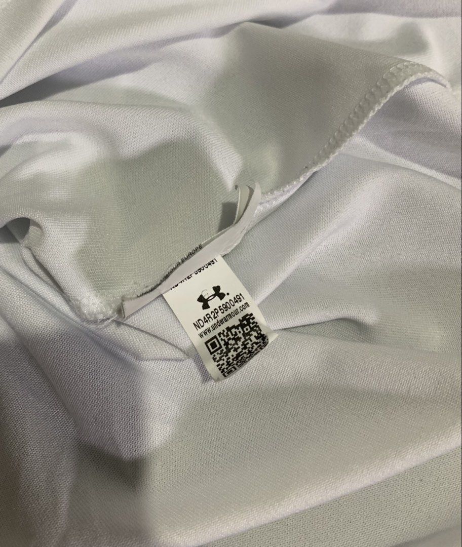 Under Armour The Tech Tee White (Category: Tshirts & Polo Shirts ) located in Cebu City. Submitted by stuff_paid (Listing ID 1468639955, Image 3). Description: - Brand: Under Armour - Item: The Tech Tee - Color: White - Size: Large (L) - Condition: Excellent / Pre-loved (as applicable) - Material: Lightweight, breathable athletic fabric - Details: Short sleeves, silver logo on chest and back collar, interior QR code tag - Style: Clean, plain desi