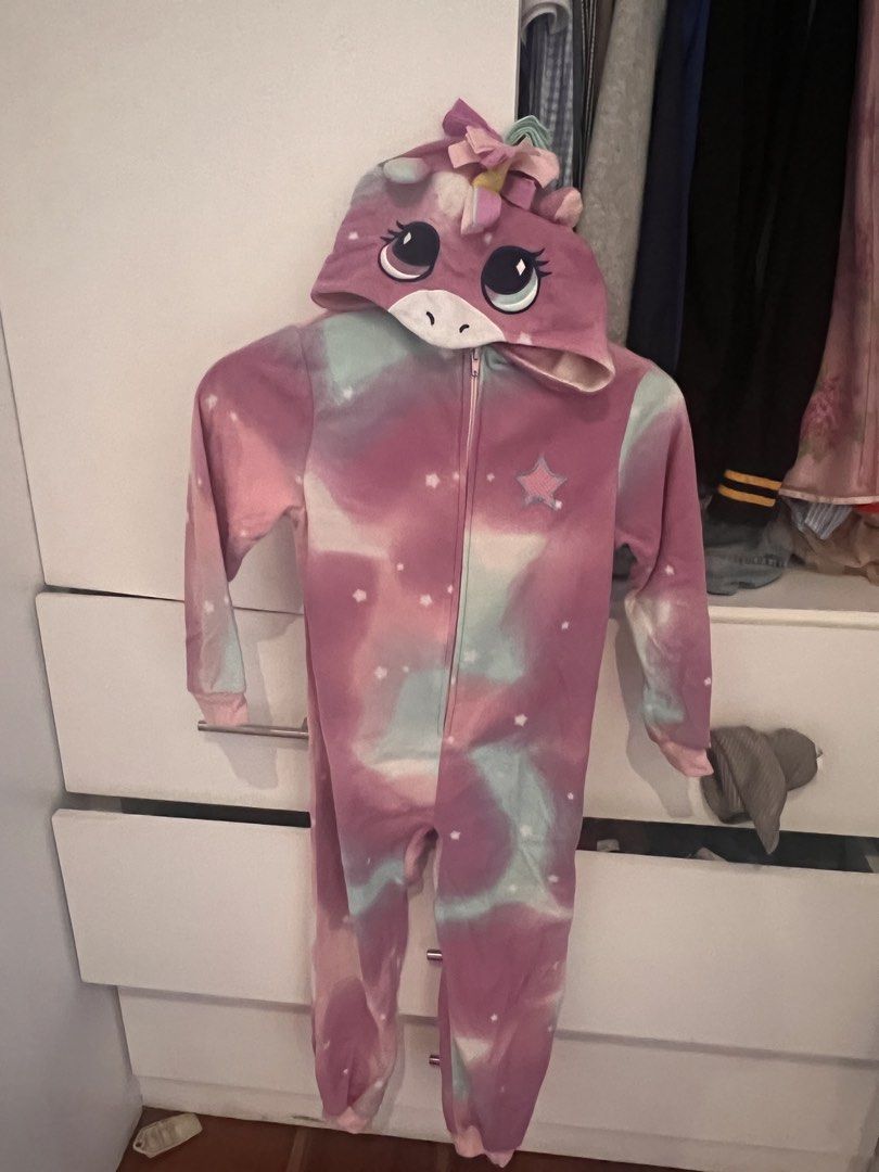 Unicorn Hooded Onesie Pyjamas (Category: Babies & Kids Fashion) located in Manila. Submitted by asecondstory (Listing ID 1468502003, Image 3). Description: - Super soft fleece fabric for ultimate comfort - Dreamy pink, purple, and mint tie-dye with white star pattern - Attached 3D hood with embroidered unicorn eyes, horn, mane, and ears - Cute pink star applique on the chest - Easy front full zipper closure - Ribbed cuffs at wrists and ankles to 