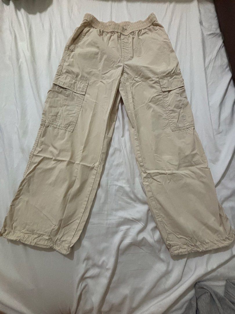 Uniqlo Beige Cargo Pants (Category: Other Bottoms) located in Manila. Submitted by _.ginny (Listing ID 1468518625, Image 2). Description: - very comfy and presko - size: S (Waist: 60-66cm, Hips: 85-91cm) - features: side cargo pockets, adjustable drawstring hem details - fits xs-s - only a small stain near the hem, but washable - rfs: decluttering - MOP: gcash / paymaya - MOD: lalamove (shouldered by the buyer) - intramuros, manila.