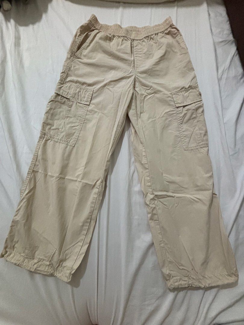 Uniqlo Beige Cargo Pants (Category: Other Bottoms) located in Manila. Submitted by _.ginny (Listing ID 1468518625, Image 1). Description: - very comfy and presko - size: S (Waist: 60-66cm, Hips: 85-91cm) - features: side cargo pockets, adjustable drawstring hem details - fits xs-s - only a small stain near the hem, but washable - rfs: decluttering - MOP: gcash / paymaya - MOD: lalamove (shouldered by the buyer) - intramuros, manila.
