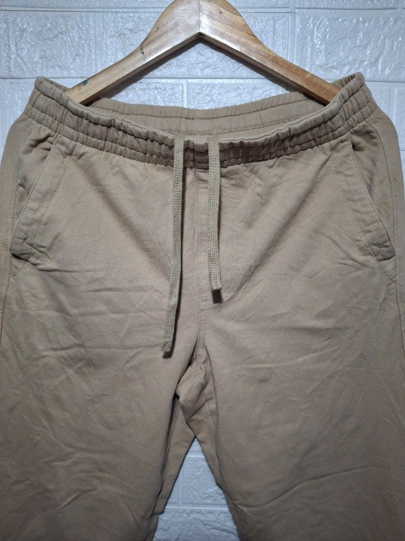 Uniqlo Beige Drawstring Pants Size M (Category: Trousers) located in Angeles City. Submitted by livemountain.e2ae07 (Listing ID 1468540620, Image 2). Description: - Brand: Uniqlo - Color: Beige - W15.2 L36.5 Hem 7.3 - Size: M (fits waist 76-84cm) - Material: 96% cotton, 4% polyurethane (comfortable with slight stretch) - Waistband: Elastic with adjustable drawstring - Pockets: Deep front pockets on both sides - Fit: Straight leg cut - Condition: 