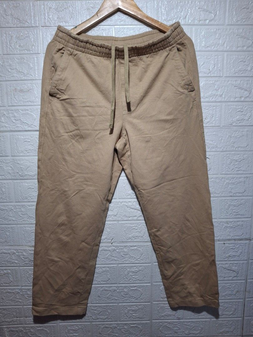 Uniqlo Beige Drawstring Pants Size M (Category: Trousers) located in Angeles City. Submitted by livemountain.e2ae07 (Listing ID 1468540620, Image 1). Description: - Brand: Uniqlo - Color: Beige - W15.2 L36.5 Hem 7.3 - Size: M (fits waist 76-84cm) - Material: 96% cotton, 4% polyurethane (comfortable with slight stretch) - Waistband: Elastic with adjustable drawstring - Pockets: Deep front pockets on both sides - Fit: Straight leg cut - Condition: 