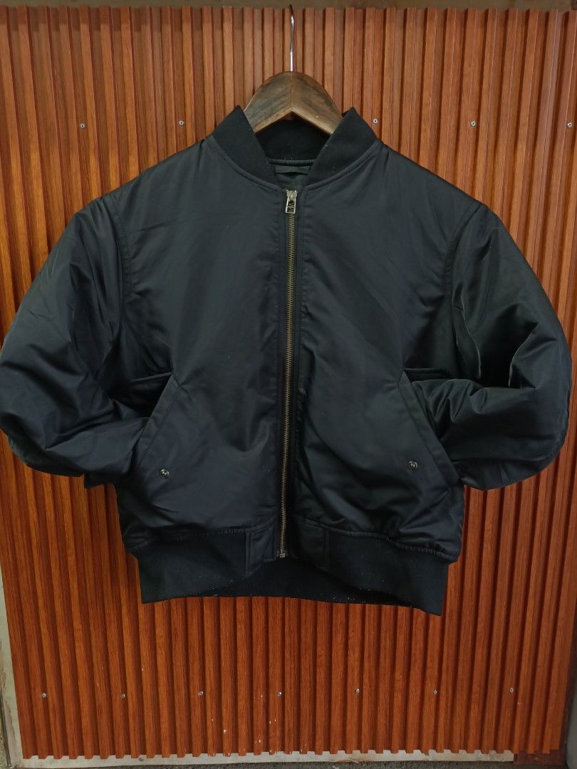 Uniqlo Black Bomber Jacket Size S (Category: Coats, Jackets and Outerwear) located in Bayombong. Submitted by rheaaa00530 (Listing ID 1468625316, Image 1). Description: - Brand: Uniqlo - Style: Classic black bomber jacket with zip-up front - Size: S (fits bust 77-83 cm) - Material: 100% polyester shell, filling, and lining; 98% polyester, 2% spandex ribbing - Features: Two side pockets, ribbed collar, cuffs, and hem - Condition: Clean, simple, an