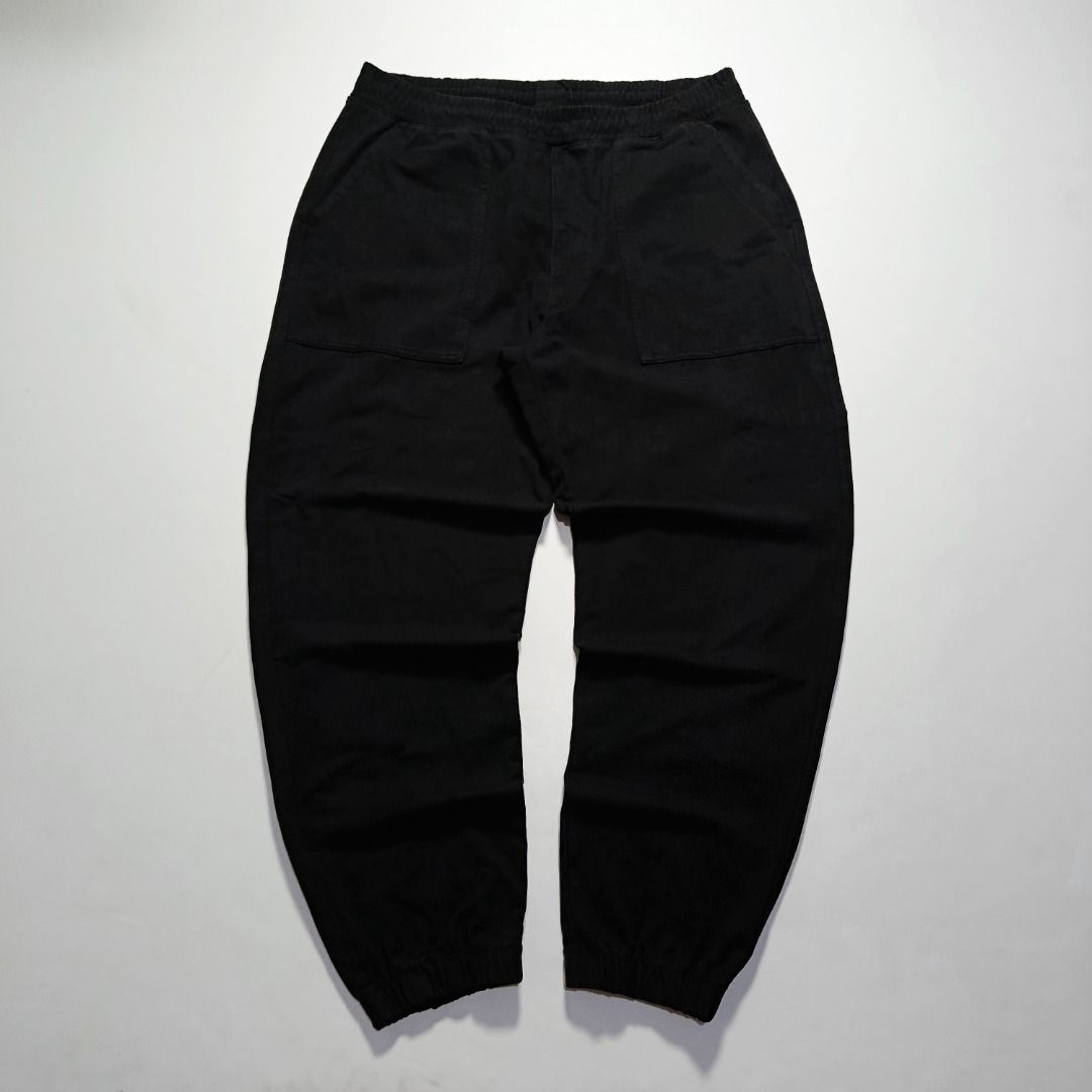 UNIQLO Black Sweat Jogger Pants (Category: Joggers) located in Taytay. Submitted by hoodgrail.vtg (Listing ID 1468604128, Image 1). Description: • Excellent condition - Lightly used • Minimalist black design with elastic waistband and ankle cuffs • Size on tag: XL — best fits 34-38 • Measurements: 17 x 40 in • Leg opening: 5.5 in (elastic) • Color rate: 9/10 • Issue: None.
