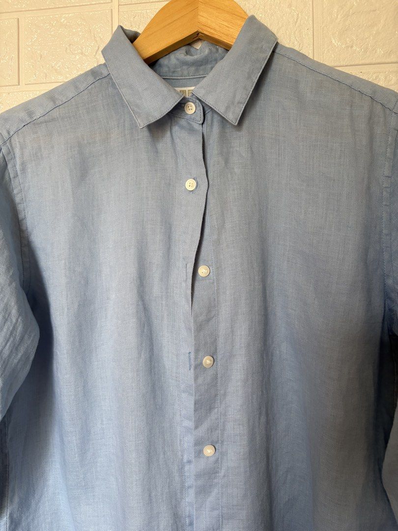 Uniqlo Blue Linen Button Down 100%Linen (Category: Longsleeves) located in Batangas. Submitted by purple_and_orange (Listing ID 1468516595, Image 3). Description: - Brand/Model: Uniqlo long sleeve shirt - Color: Light blue - Material: 100% pure linen - Size: S (tag on collar) - Features: Standard button-up front, classic collar, lightweight fabric with natural texture - Style: Great basic for casual or smart casual outfits.