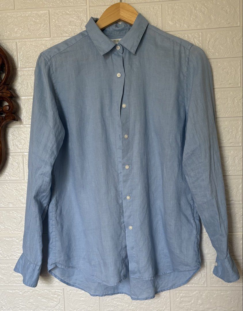 Uniqlo Blue Linen Button Down 100%Linen (Category: Longsleeves) located in Batangas. Submitted by purple_and_orange (Listing ID 1468516595, Image 2). Description: - Brand/Model: Uniqlo long sleeve shirt - Color: Light blue - Material: 100% pure linen - Size: S (tag on collar) - Features: Standard button-up front, classic collar, lightweight fabric with natural texture - Style: Great basic for casual or smart casual outfits.