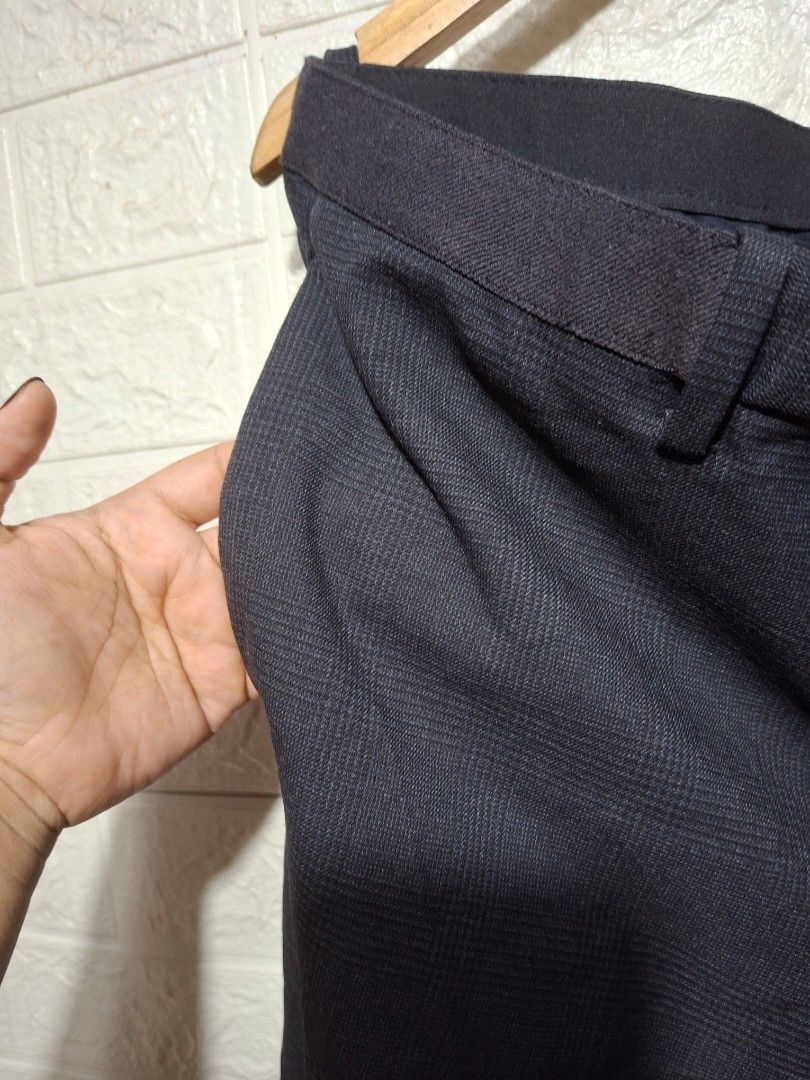 Uniqlo Checked Drawstring Trousers XL (Category: Trousers) located in Angeles City. Submitted by livemountain.e2ae07 (Listing ID 1468547152, Image 3). Description: - Brand: Uniqlo - Color: Navy blue with classic check pattern - Size: XL (fits 92-100cm waist) - W18 L36 HEM 7.6 - Material: Lightweight blend of polyester, rayon, and polyurethane - Waistband: Elastic with adjustable drawstring - Closure: Button fly - Pockets: Two back pockets with bu